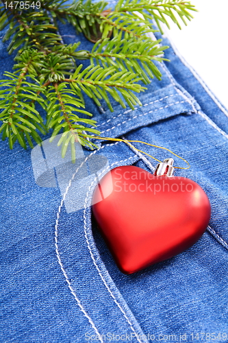 Image of Christmas tree and toy on denim background.