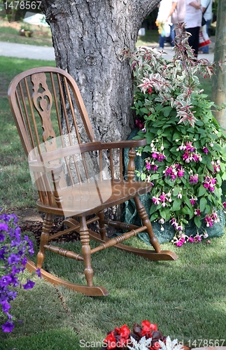Image of Rocking chair and flowers