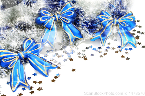 Image of Christmas garland with blue ribbons.