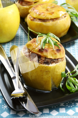 Image of Apples stuffed with chicken, prunes and nuts.