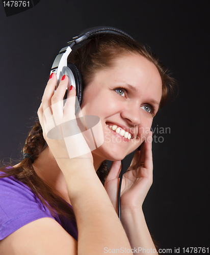 Image of smiling girl in the headphones