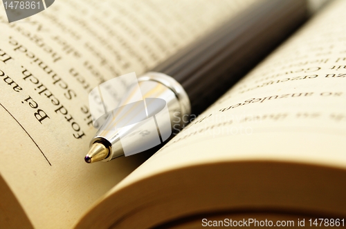 Image of book and pen