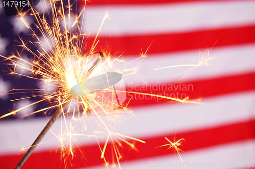 Image of sparkler and usa flag