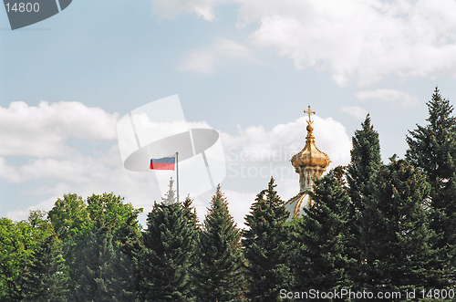 Image of Peterhof. Russian flag and the Dome of the Palace.