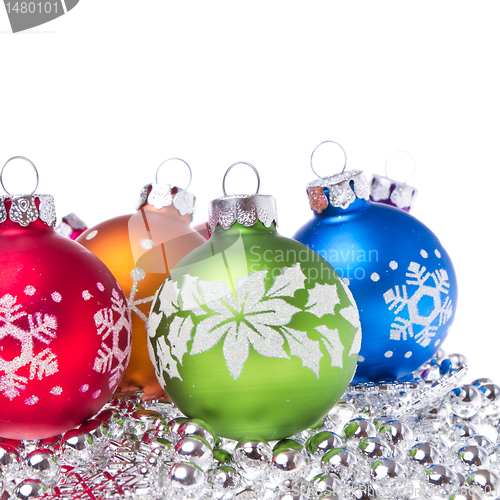 Image of christmas balls with snowflake symbols