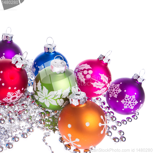 Image of christmas balls with snowflake symbols