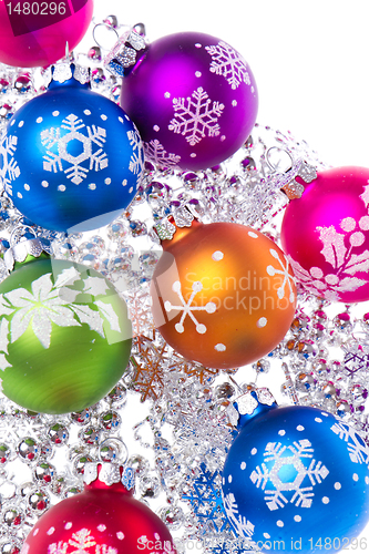 Image of christmas balls with snowflake symbols