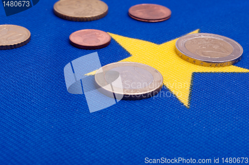 Image of Euro Coins on EU Flag