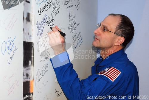 Image of Signing a Poster