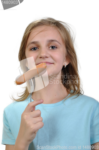 Image of Young girl with boiled hot dog