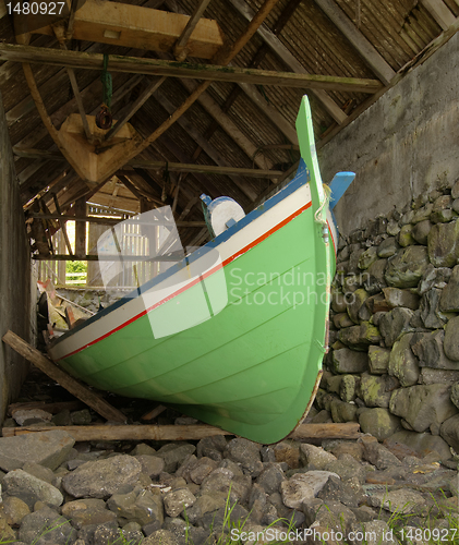 Image of Traditional Faroese fishing boat made of wood in an old bo