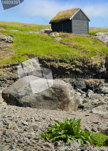 Image of Wood storehouse with grass roof