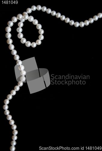 Image of White pearls on the black velvet 