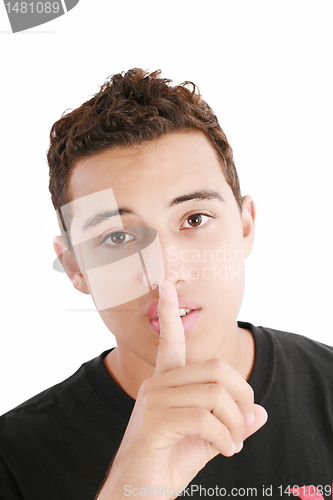 Image of young man with finger on his mouth isolated over white backgroun