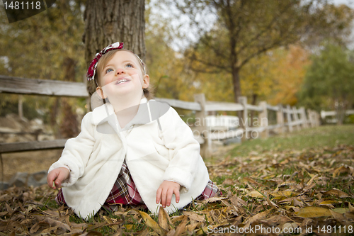 Image of Adorable Baby Girl Playing in Park
