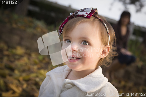 Image of Adorable Baby Girl Playing in Park with Mom