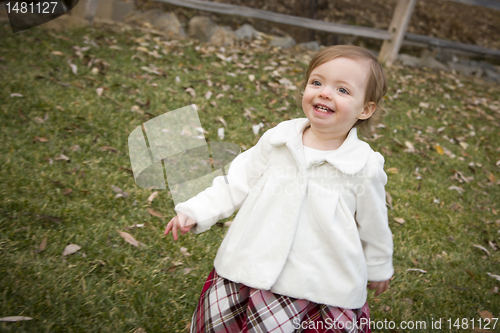 Image of Adorable Baby Girl Playing in Park