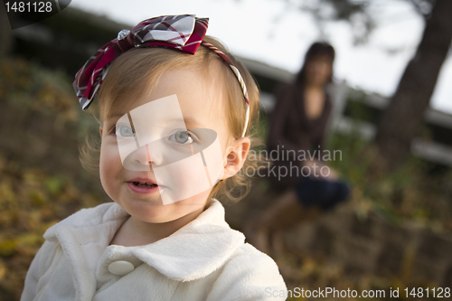 Image of Adorable Baby Girl Playing in Park with Mom