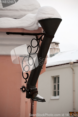 Image of street rainwater pipe in the form of high boot