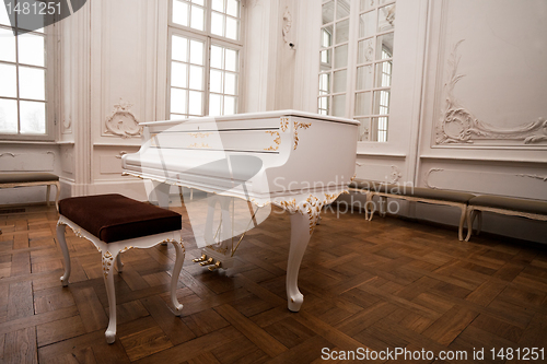 Image of white grand piano