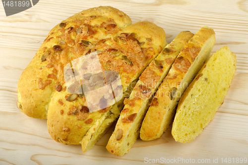 Image of sliced corn bread with pumpkin seeds
