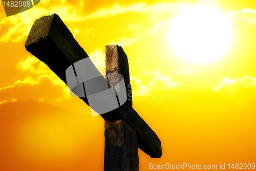 Image of cross on sunset