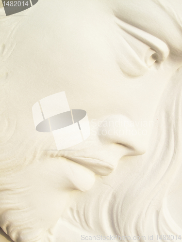 Image of jesus christ on white marble tombstone