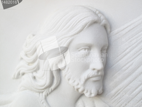 Image of jesus christ on white marble tombstone