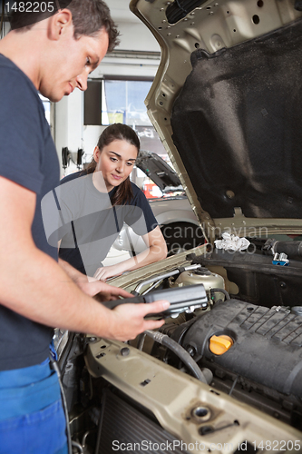 Image of Mechanics with Diagnostic Equipment