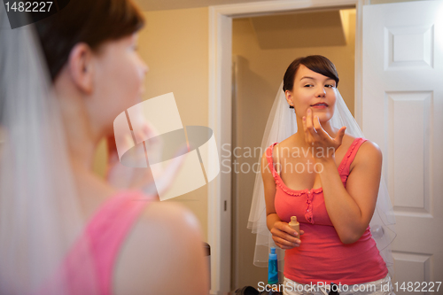 Image of Bride Applying Make up