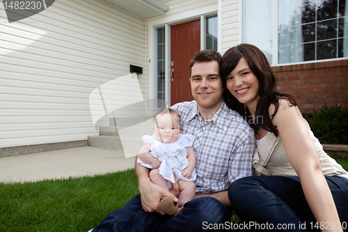 Image of Happy Young Couple with Daughter