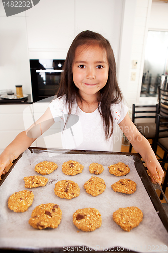 Image of Cute Young Girl Baking Cookies