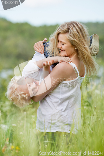 Image of Playful mother with cute child