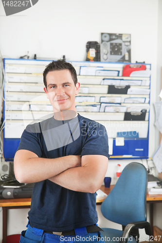 Image of Handsome mechanic at auto repair shop