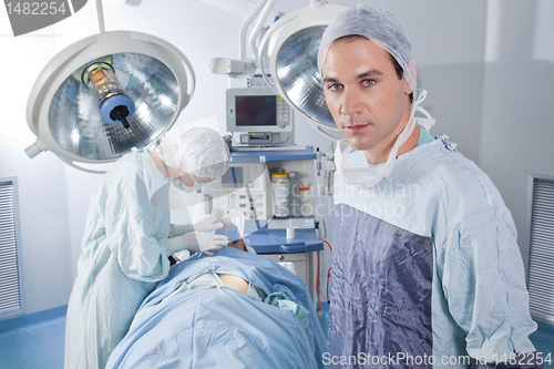 Image of Male doctor confident while surgery