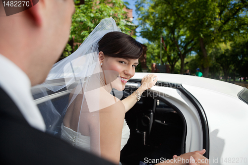 Image of Bride Getting in Limo