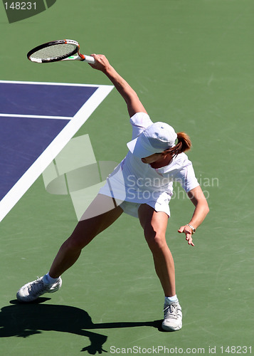 Image of Woman playing tennis