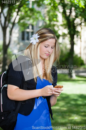 Image of Young girl using cell phone