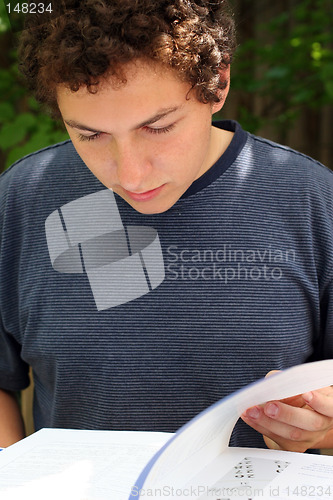 Image of Boy reading a book