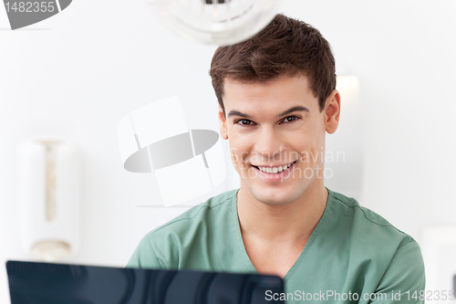 Image of Young dental assistant smiling