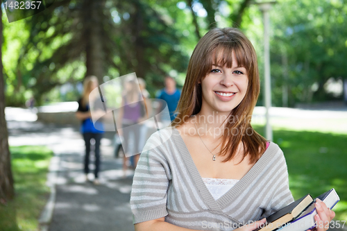 Image of Portrait of smiling young college girl