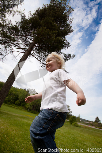 Image of Boy Running Outside