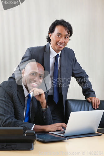Image of Businessmen working on laptop