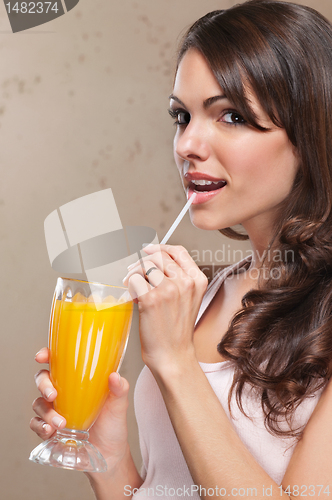 Image of Close-up of woman drinking orange juice