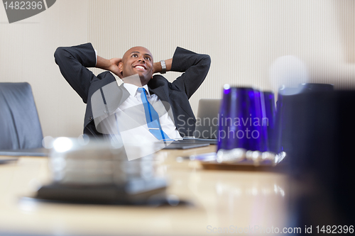 Image of Relaxed businessman daydreaming