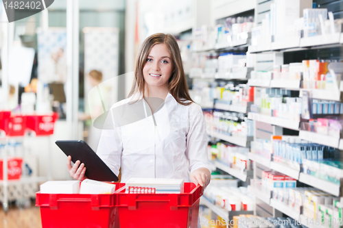 Image of Female Chemist Holding Tablet PC