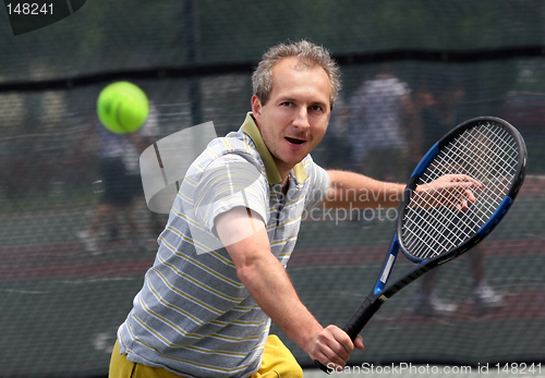 Image of Middleage man playing tennis