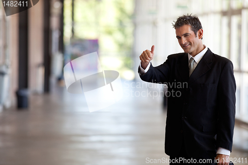 Image of Businessman Gesturing Thumbs Up