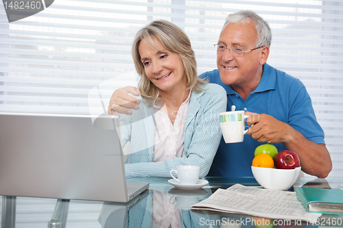 Image of Happy Couple Using Laptop