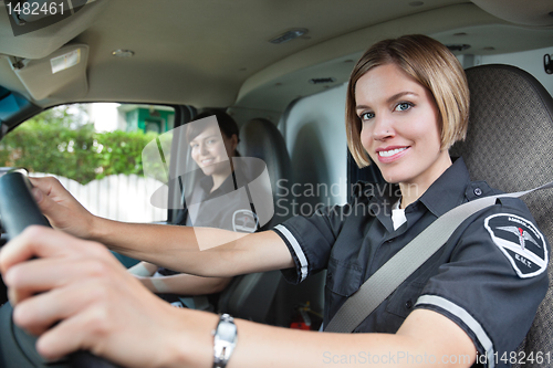 Image of Happy Female Paramedic in Ambulance